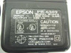 Epson PB-6509 M34PB rating label showing 120V 60Hz input, 33V DC 1A output, UL listing, and Seiko Epson Corp. Made in Taiwan markings