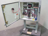 Leybold-Heraeus electrical enclosure interior view with door open showing motor contactors, fuses, transformers, and terminal blocks