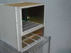 Nortel Passport 6480 NTJS61BA chassis — right-side angle view showing card cage interior with backplane connector visible at rear right and power supply bay guide rails below