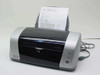 Epson Stylus C82 inkjet printer front view with Windows XP test page printing from paper tray