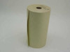 Single canary yellow teletype paper roll standing upright showing full height and width