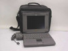 Apple PowerBook 520 laptop open showing keyboard, trackpad, and passive-matrix display, with carry case and AC adapter