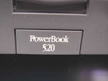 Close-up of Apple PowerBook 520 model nameplate on front bezel