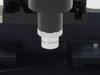 Close-up of Rolyn Germany objective barrel mounted to the stage — 'Rolyn Germany' text clearly visible on the objective collar