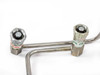 CTI Cryogenics 8143143 helium supply and return line pair laid flat showing SUPPLY (green label) and RETURN (red label) Aeroquip couplings and stainless tubing bends