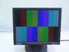 Samsung SyncMaster 152N 15-inch LCD monitor powered on displaying a color bar test pattern — screen fully lit with no dead pixels visible