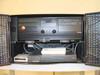 VTEL WG500 system lower cabinet open showing black PC tower with optical and floppy drives, US Robotics Sportster modem, and MultiTech Multiband ISDN unit