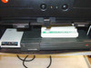 Close-up of VTEL WG500 lower shelf components: MultiTech Multiband ISDN modem, US Robotics modem, and additional telecom hardware