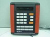 Kronos 8600265-026 time clock front panel close-up showing 'B1 BATT LOW' on dot-matrix display, numeric and function keys, orange Clear and Enter buttons