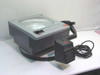 3M 9000AJB 9100 Overhead Projector shown with arm folded down, projector head detached and resting beside unit with power cord — front and side view