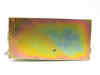 Motorola SGPN4018A Microcite Power Supply – bottom/side panel view showing iridescent anodized metal chassis with mounting hardware and cable exit
