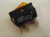 Idec Izumi Arcolectric C1403FQ illuminated rocker switch – front label view showing model number, 10(3)A 250V AC rating, T85 temperature rating, UL/cUL marks, and neon lamp 270V designation
