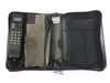 Motorola SCN2449A bag phone open in travel bag showing handset on left and accessories compartments with car charger on right