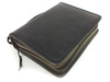 Motorola branded black leather travel bag closed, showing Motorola logo embossed on cover with zipper closure