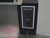 Photosonic ultrasonic tank control panel close-up — black panel showing Ultrasonic Generator and Heater outlet receptacles on side of stainless tank