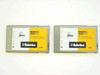 US Robotics Megahertz XJ4338 33.6K PCMCIA PC Card modems — front face showing yellow and gray label, two units