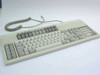 Decision Data C1410A terminal keyboard full top view with coiled RJ-11 cable attached