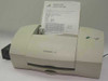 Lexmark Z31 inkjet printer front view with Windows XP test page loaded in paper tray