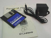 Linksys ParaSCSI Plus accessory set — 3.5-inch utility floppy disk, user guide booklet, power adapter, and mounting clips
