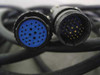 Multi-pin circular cable connectors – female socket (blue insert, ~24 pins, labeled 025-028) and male plug (gold pins) of the included QuickSet connection cable