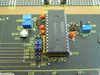 Close-up of DSP202 section of evaluation fixture board showing Burr-Brown DSP202JP IC, DAC FUNC jumper block, RESET button SW1, and test point TP2