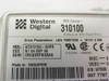 Western Digital WD Caviar 310100 drive label close-up showing model AC310100-00RN, 10141.2 MB, LBA 19807200, Made in Singapore, dated 04 Sep 1998