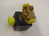 Parker Gold Ring solenoid valve top view showing brass valve body with yellow port protection caps and black solenoid coil assembly mounted on top