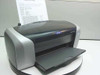 Epson Stylus C86 color inkjet printer – front 3/4 view with output tray open and test page loaded in rear feed