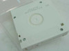 Bottom of Quantum DLTtape III XT cartridge showing reel hub and stamped serial number markings