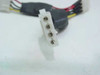 Close-up of 4-pin Molex female connector end showing four metal pin contacts in white housing