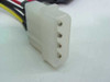 Close-up of 4-pin Molex male connector end showing four receptacle contacts in white housing