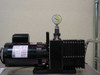Alcatel 1004AC rotary vane vacuum pump on bench – side view with vacuum gauge attached to inlet port via fitting
