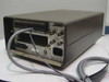 Keithley 705 Scanner rear panel showing two card slots, IEEE-488 GPIB connector, Serial Out, Channel Ready, External Trigger, Alarm BNC connectors, and IEC AC power inlet