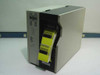 Zebra Z90GM thermal transfer barcode label printer – front left three-quarter view with yellow barcode labels loaded