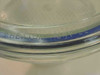 Close-up of Wheaton Dry Seal embossed text on glass rim of desiccator bowl with blue rubber gasket seal visible