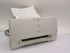 Canon BJC-4200 Color Bubble Jet Printer front view with paper loaded in input tray and Windows XP test page in output tray