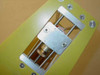 Close-up of fuse holder and lamp indicator assembly mounted in aluminum bracket on yellow panel