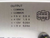Apple AA11040B power supply output label showing +5V 2.5A, +12V 1.5A, -12V 0.25A, -5V 0.25A ratings and 6-pin connector diagram