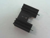 Aavid black anodized TO-220 heat sink – angled top view showing dual fin arrays and two PCB mount pins