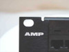 Close-up of AMP logo on the left end panel of the 406331-1 Cat 5e patch panel with rackmount ear and RJ-45 ports visible