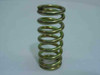 Heavy duty compression spring 2-1/4 inch length – upright end-on view showing circular coil form and zinc plating