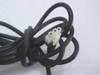 Close-up of the proprietary multi-pin white output connector on the Control Module 2061-002A AC adapter cable