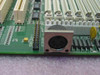 AMI Titan-II motherboard corner detail showing PS/2 keyboard port, header connectors, and expansion slot area