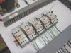 Close-up of Schneider Electric solid-state relays and motor protection breakers on the Stulz ENS-14 switching panel
