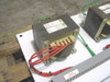 Close-up of Square D step-down transformer on Stulz ENS-14 switching panel with red high-voltage warning label