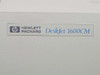 HP DeskJet 1600CM nameplate close-up showing Hewlett-Packard DeskJet 1600CM logo