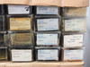 Detail of Gordon Enterprises parts bins showing Fairchild and Bell & Howell labeled components including gaskets and plate assemblies