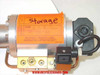 VAT Series 108 UHV gate valve — close-up of orange shipping/storage label on pneumatic cylinder reading 'Storage' with handwritten 'K.C. Fuller / 30-60-70' and instruction to remove label after receipt; solenoid valve block detail visible
