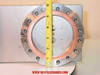 VAT Series 108 UHV gate valve — close-up of flange face with tape measure showing approximately 6 inches outer diameter; copper gasket groove and bolt-hole ring clearly visible