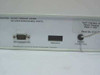 Multimon Multi-Interface Unit rear panel close-up showing UPS Connection DB9, Bridging header, Power Connection, and 'Manufactured by Systems Enhancement Corporation' label